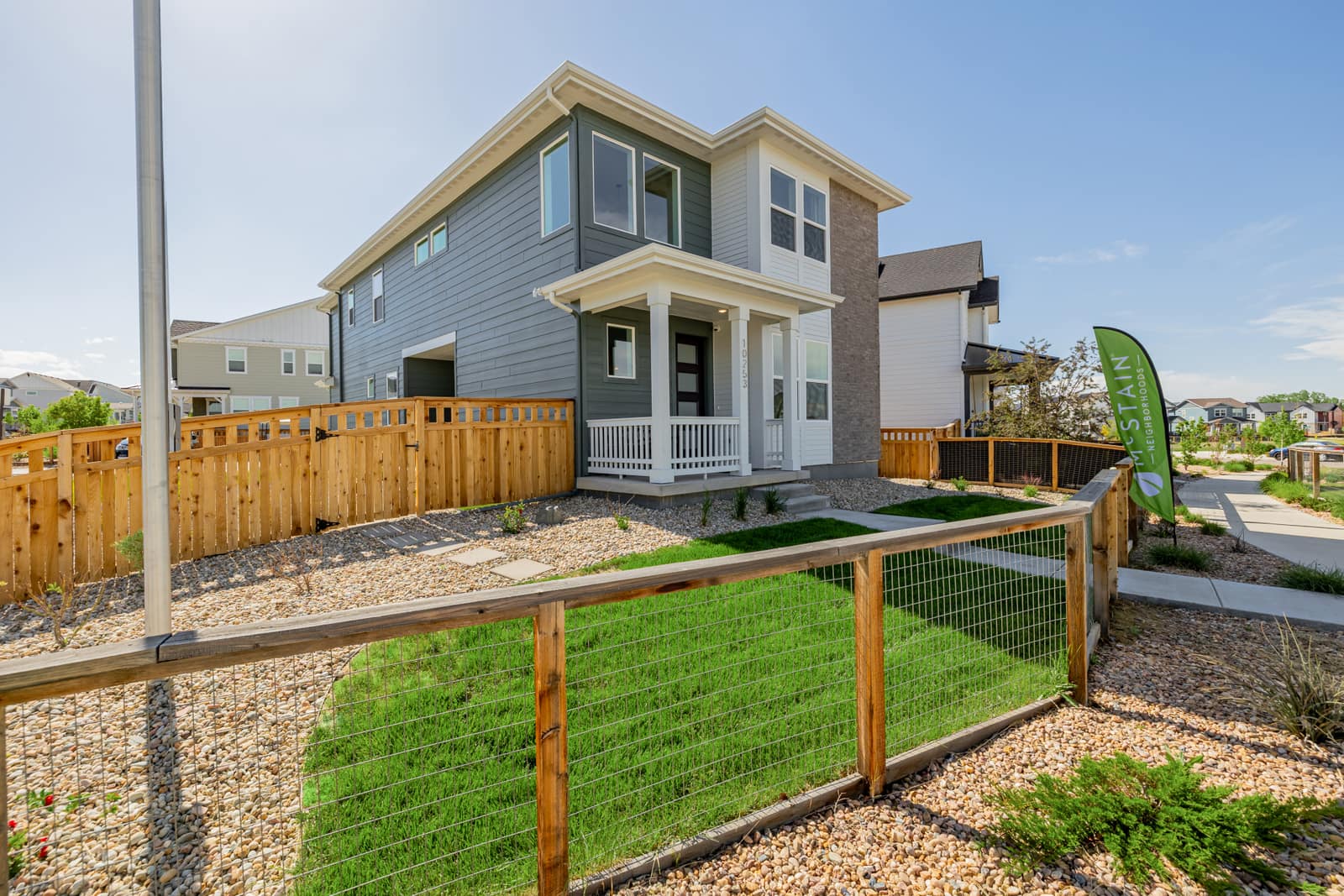 Home beside a landscaped walking path at Arras Park in Thornton, CO 80229