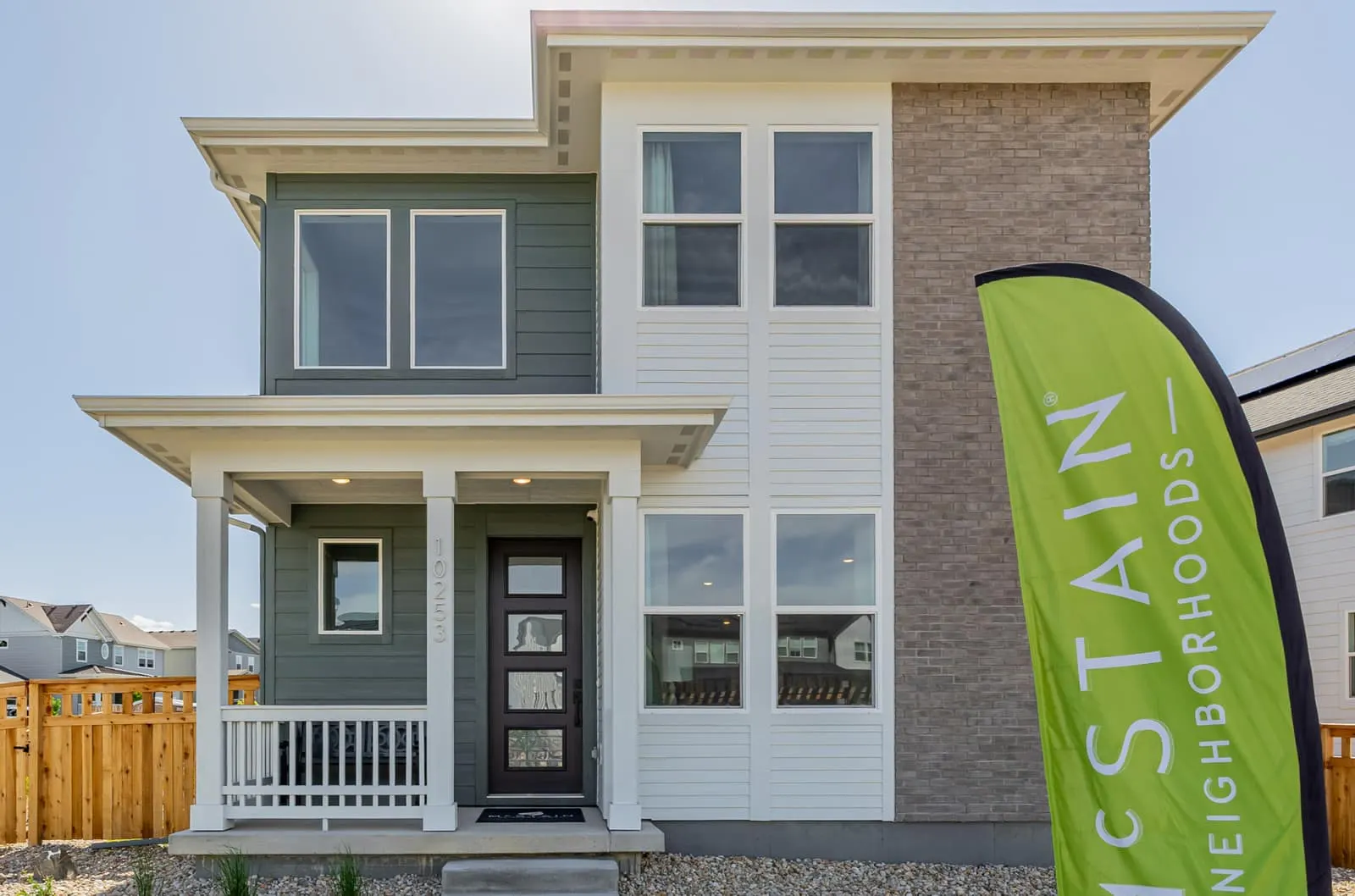 Front entrance of a three-story home at Arras Park in Thornton, CO 80229