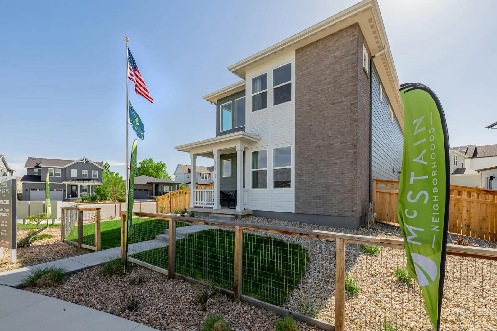 Three-story home and front landscaping at Arras Park in Thornton, CO 80229