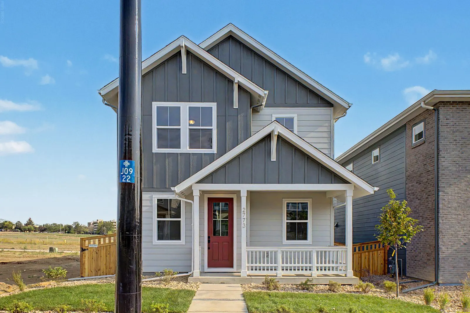 Blue home exterior with covered porch at 2773 E. 103rd Ave in Arras Park, Thornton, Colorado