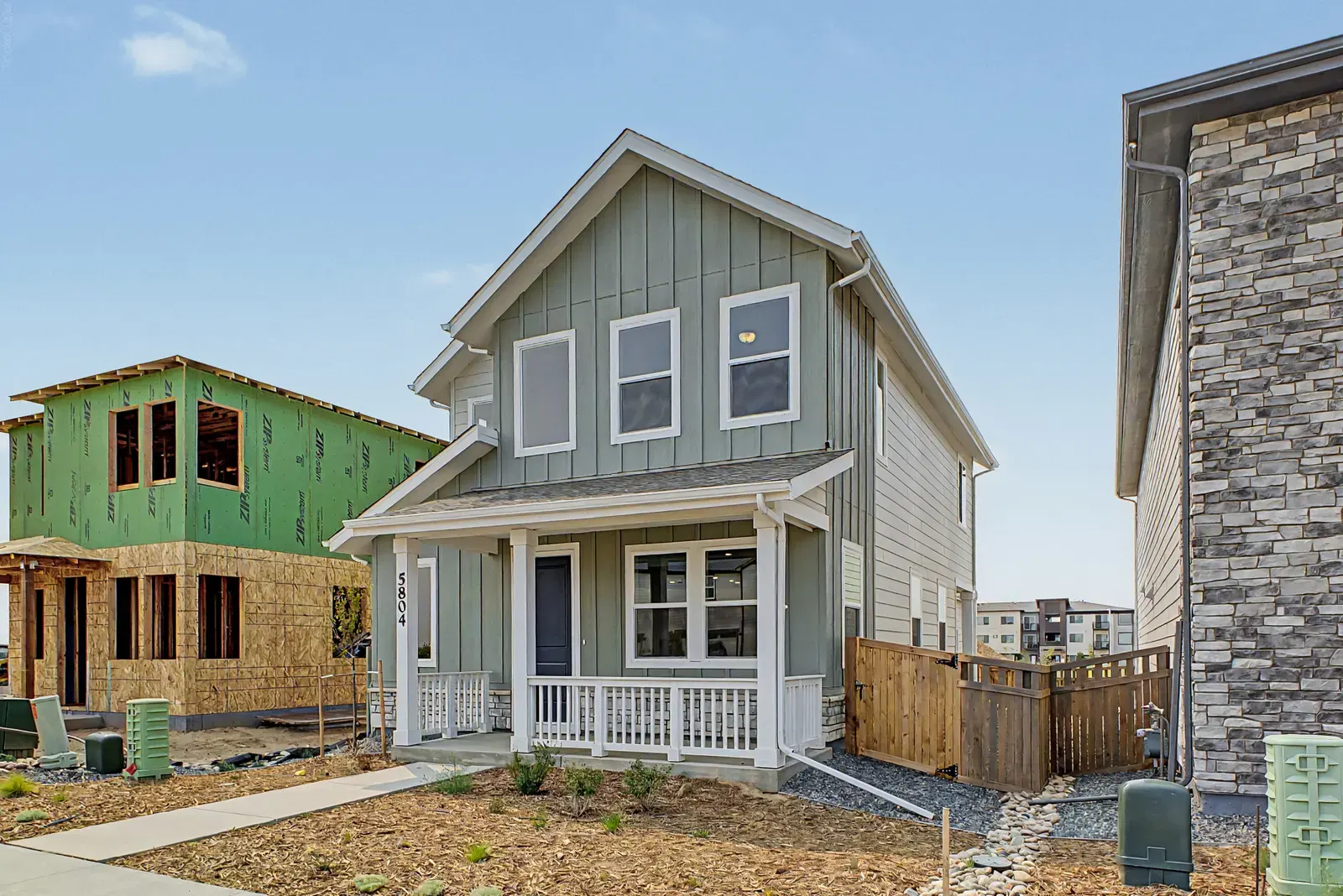 Covered porch and front windows at 5804 N Perth Street in Painted Prairie, Aurora, Colorado