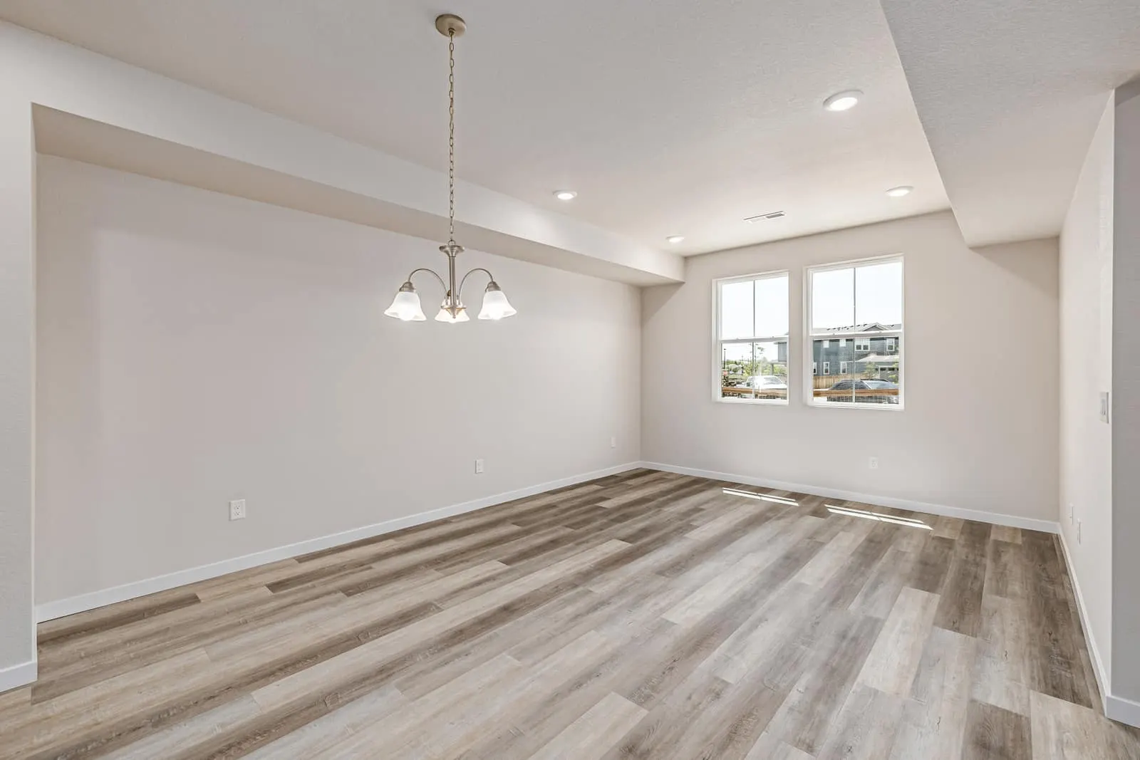 Dining area with hanging light fixture at 2877 E. 103rd Drive in Arras Park, Thornton, Colorado