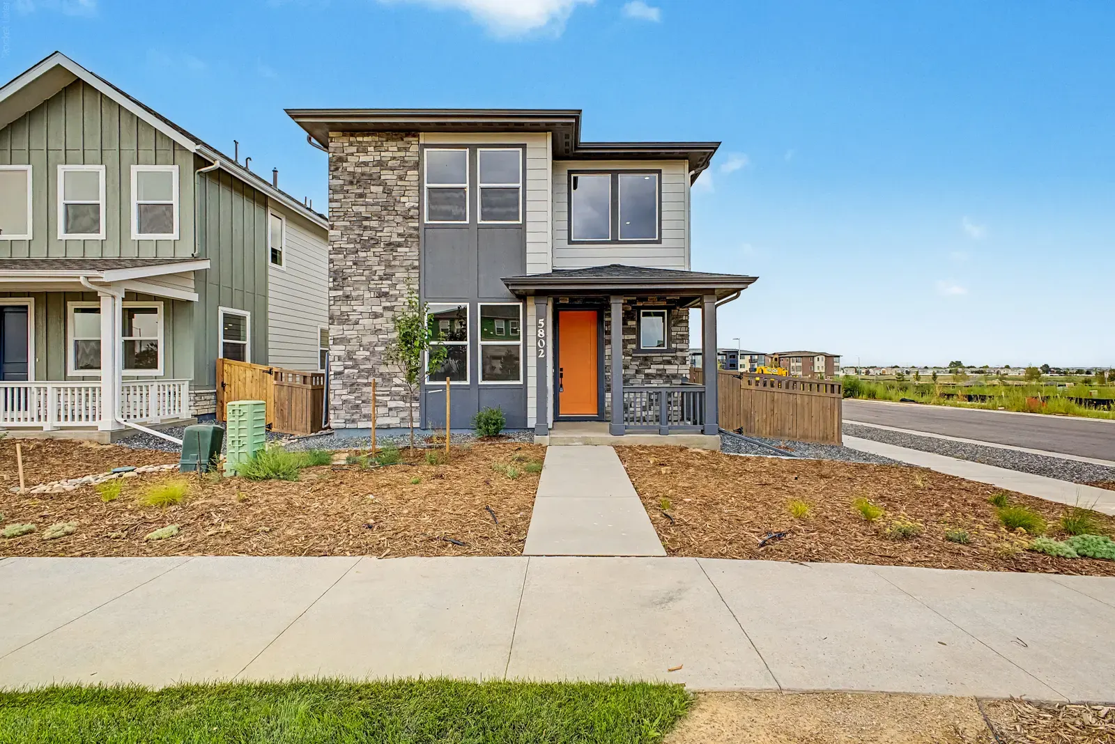 Home exterior and front path at 5802 N Perth Street in Painted Prairie, Aurora, Colorado