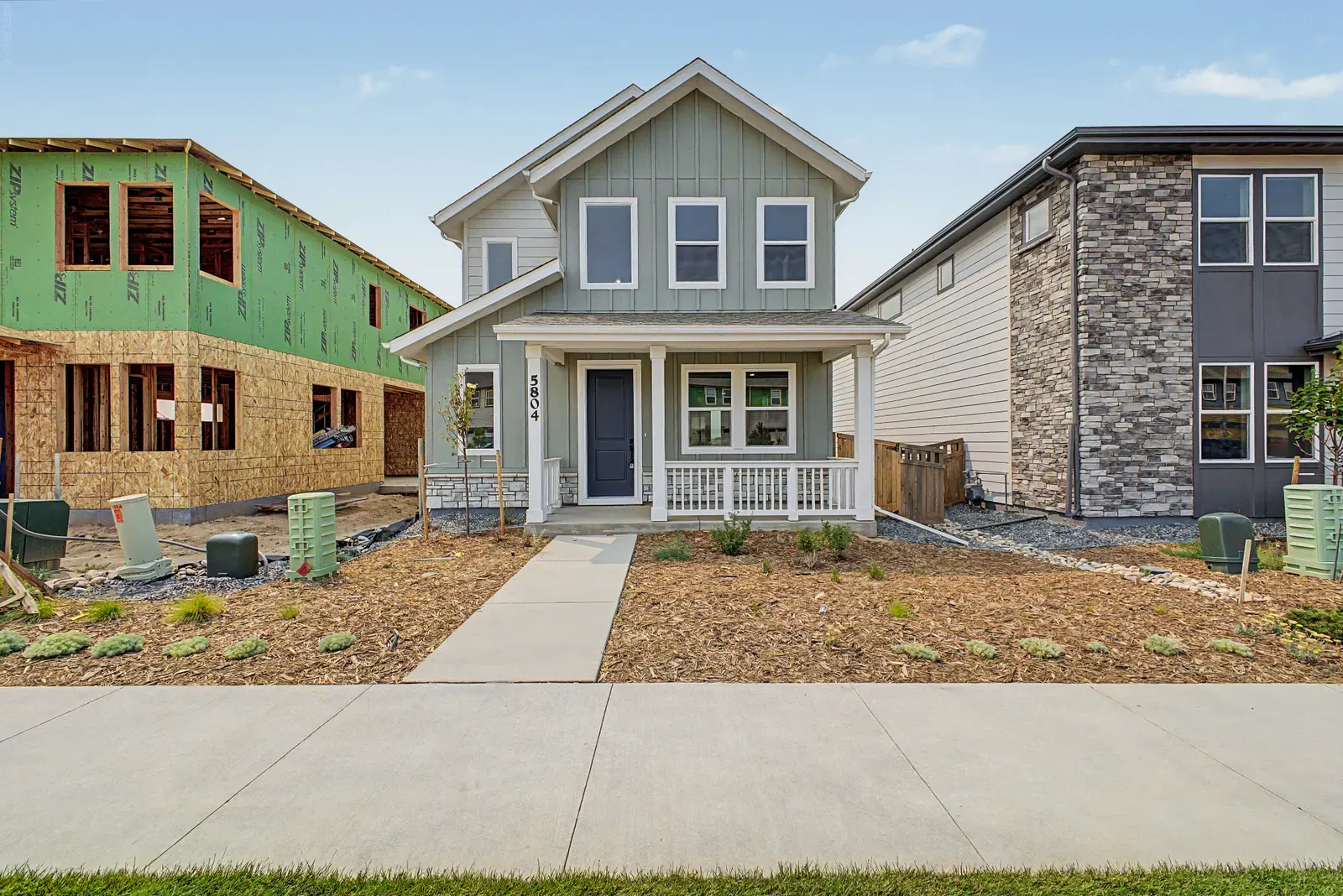 Home exterior beside neighboring homes at 5804 N Perth Street in Painted Prairie, Aurora, Colorado