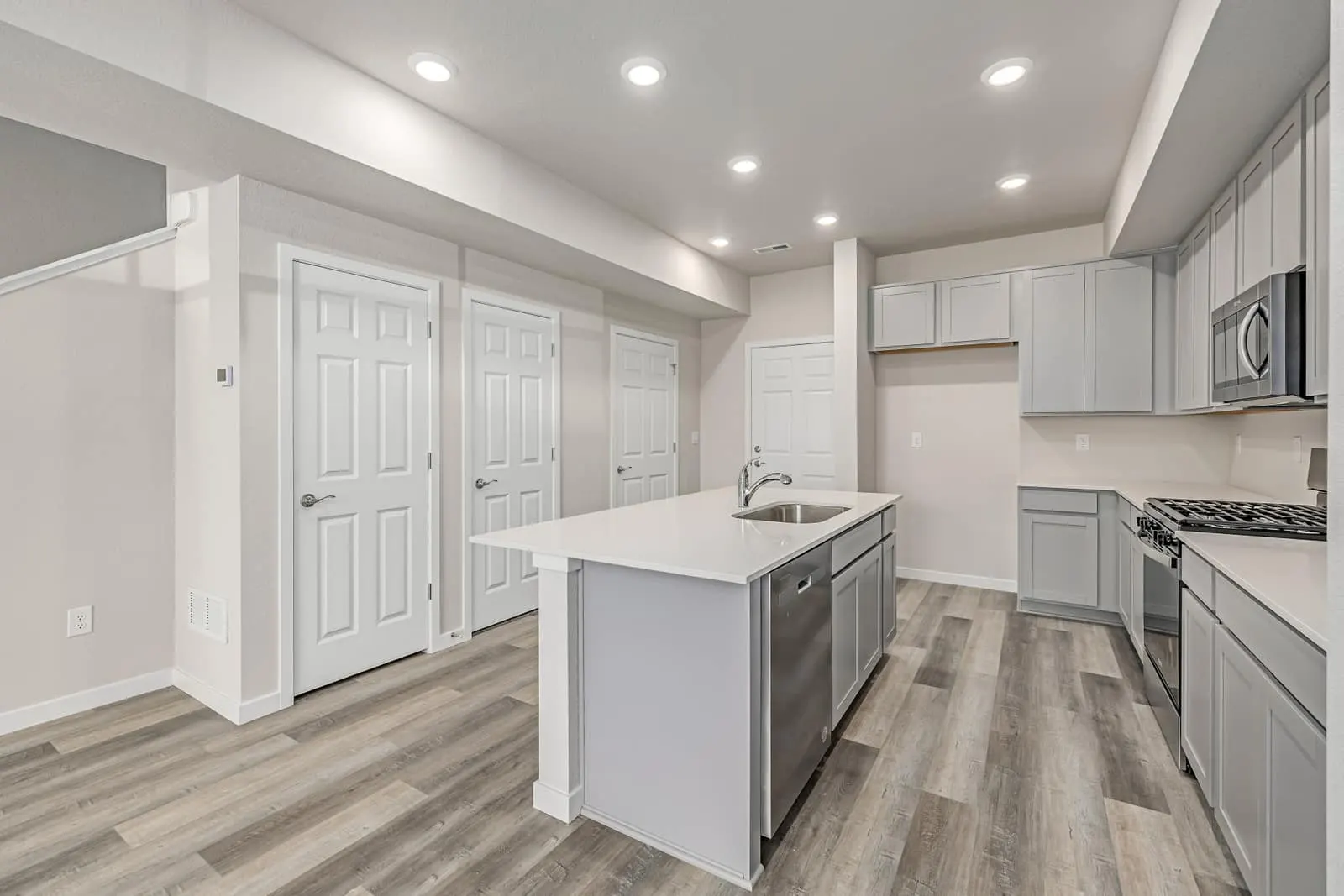 Kitchen and open living area at 2887 E. 103rd Drive in Arras Park, Thornton, Colorado