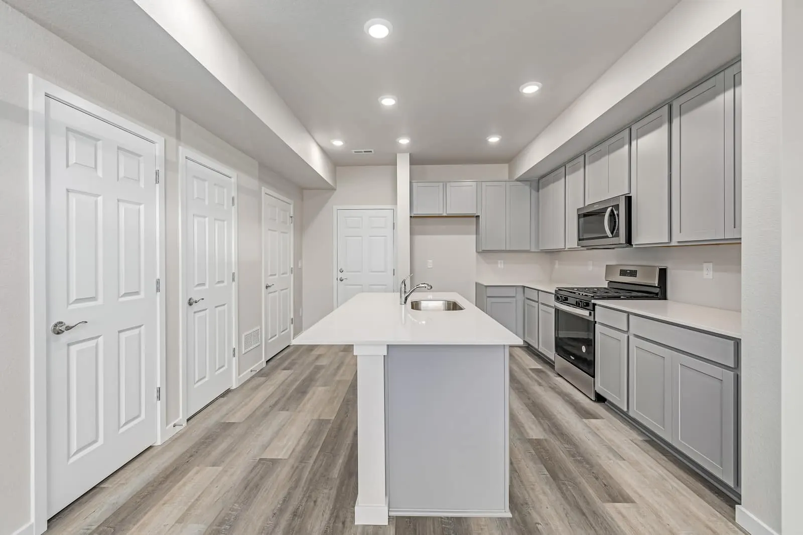 Kitchen island and dining area at 2887 E. 103rd Drive in Arras Park, Thornton, Colorado