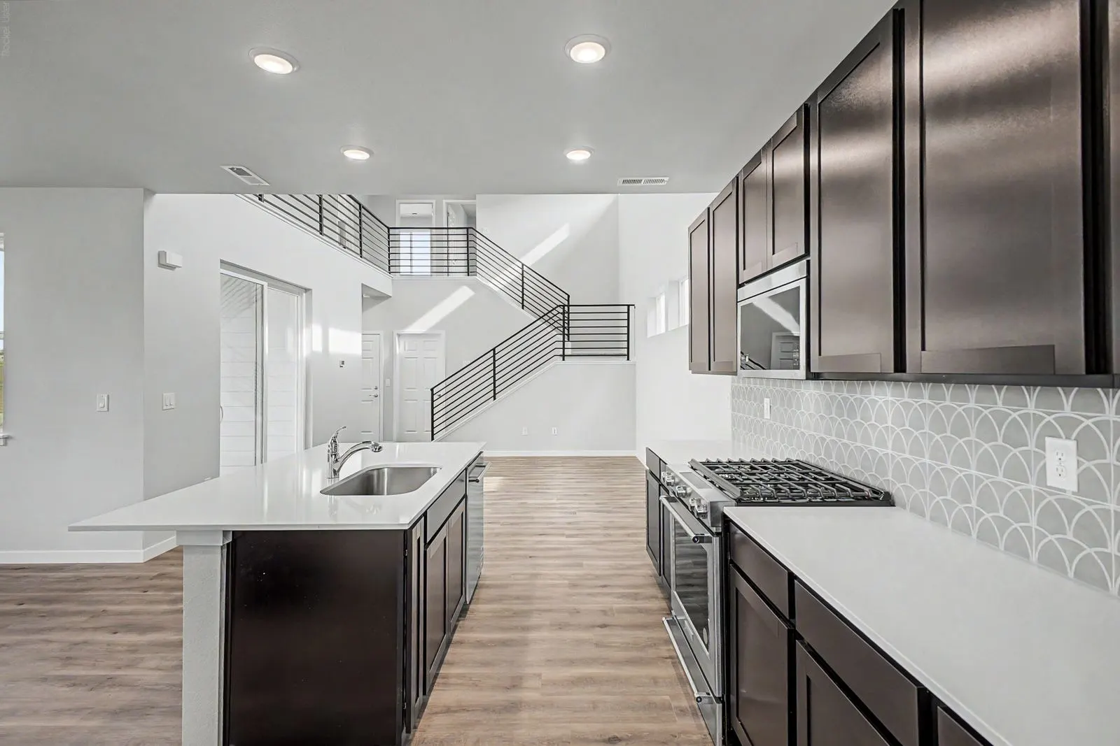 Kitchen looking toward the staircase at 2773 E. 103rd Ave in Arras Park, Thornton, Colorado