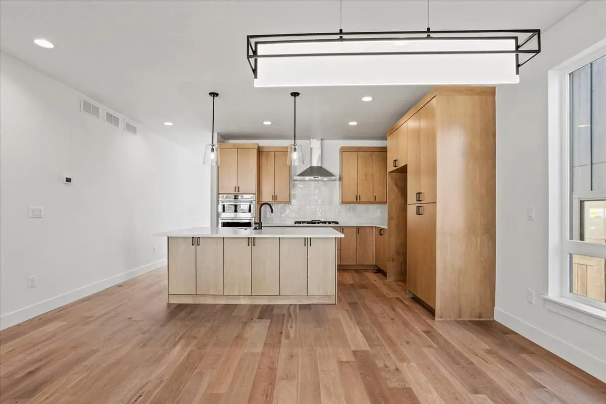Kitchen viewed from the living area at 5604 Grandville Ave in West Grange, Longmont, Colorado