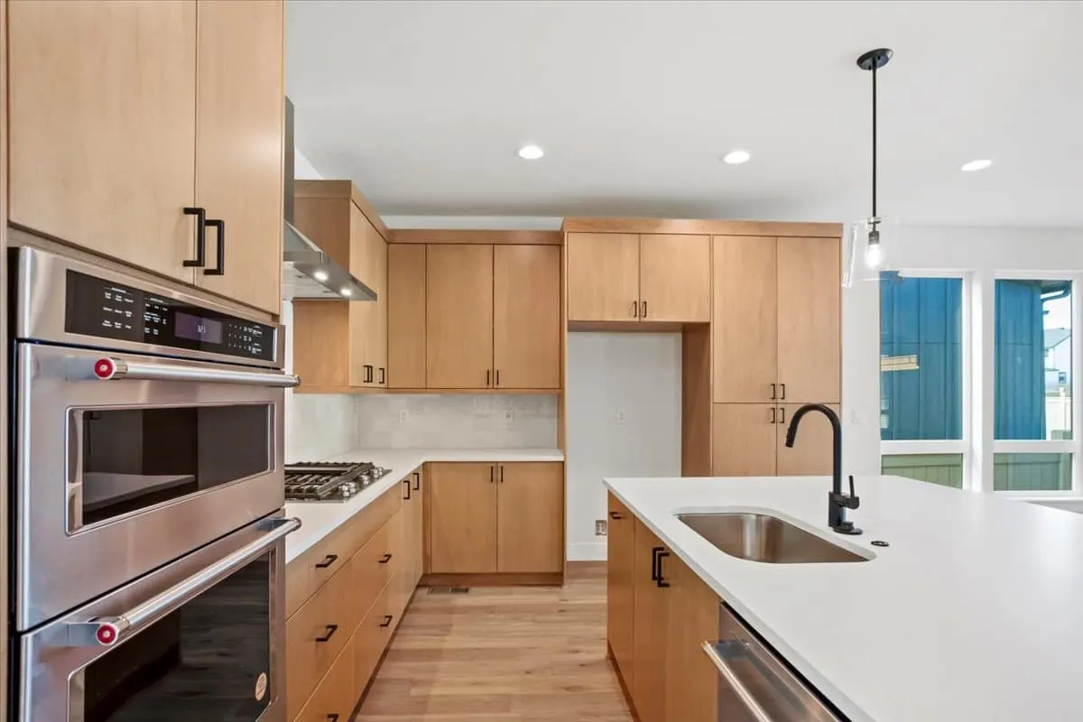 Kitchen with built-in ovens at 5604 Grandville Ave in West Grange, Longmont, Colorado