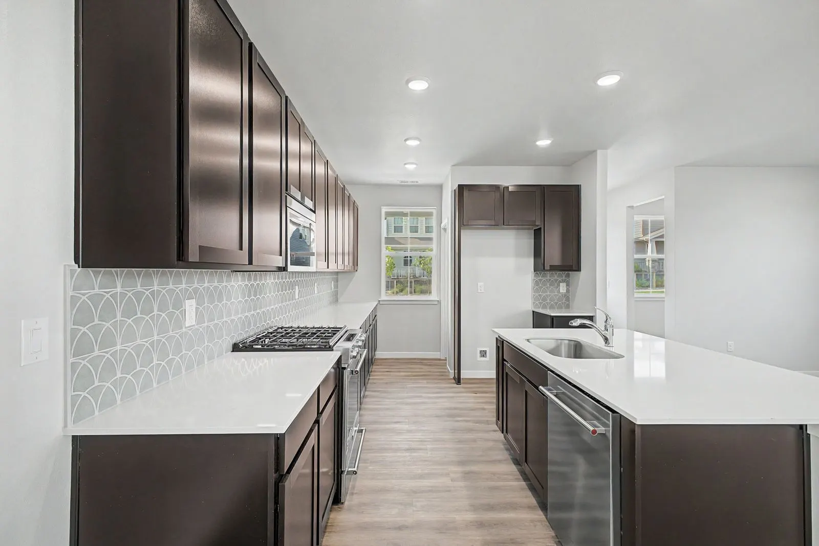 Kitchen with dark wood cabinetry at 2773 E. 103rd Ave in Arras Park, Thornton, Colorado