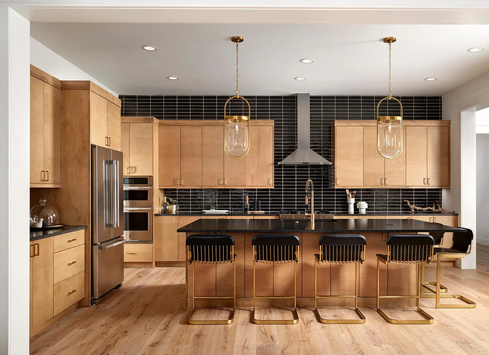 Kitchen with wood cabinetry and dark island at 1781 Chestnut Ave in Westerly, Erie, Colorado