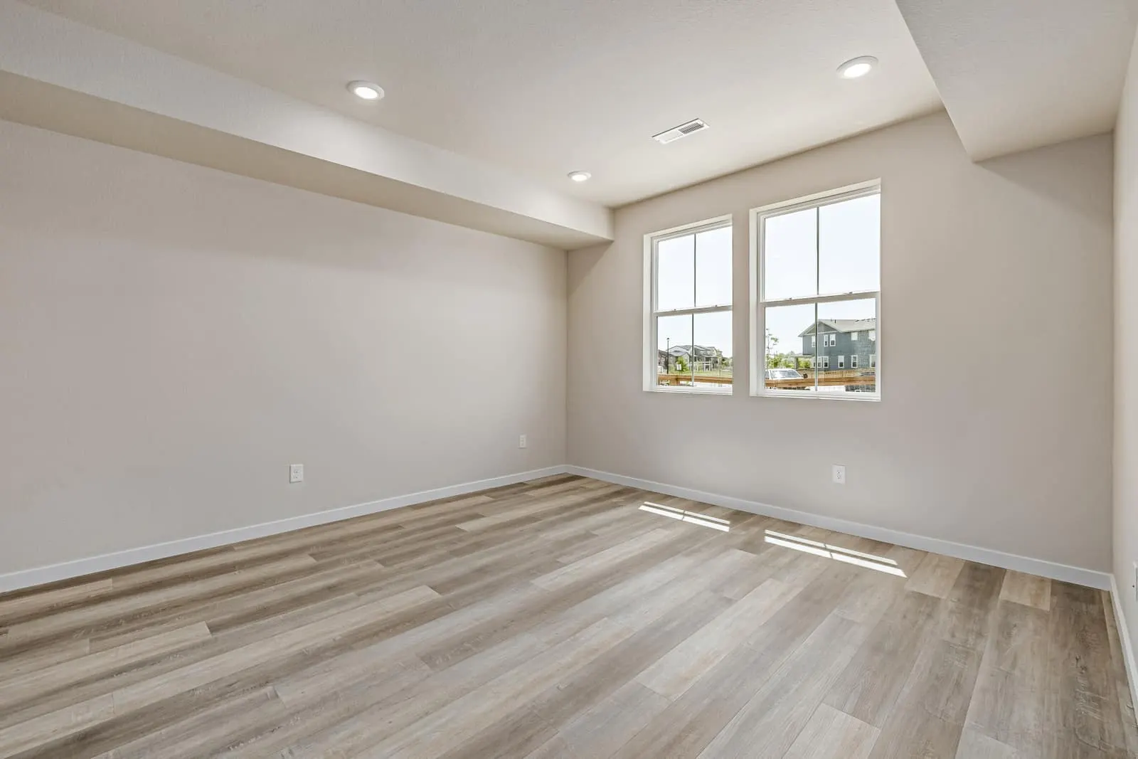 Living area beneath a sloped ceiling at 2877 E. 103rd Drive in Arras Park, Thornton, Colorado