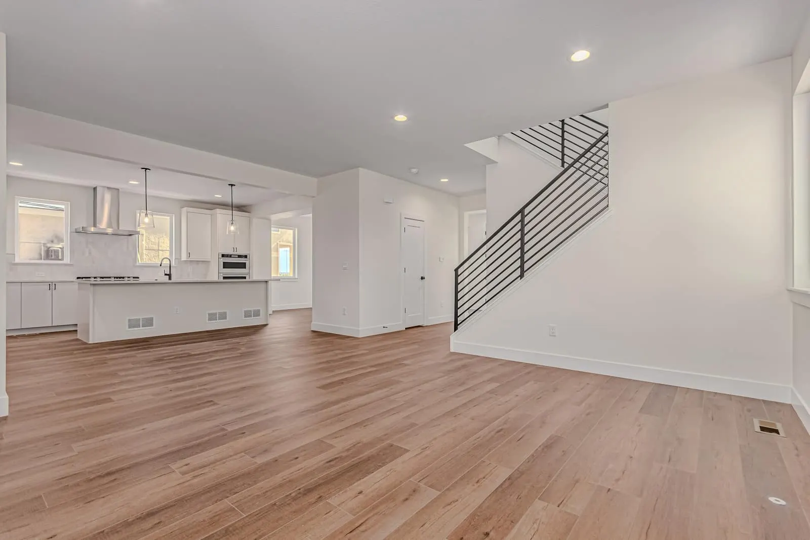 Living area beside an open staircase at 763 Mountain Drive in West Grange, Longmont, Colorado