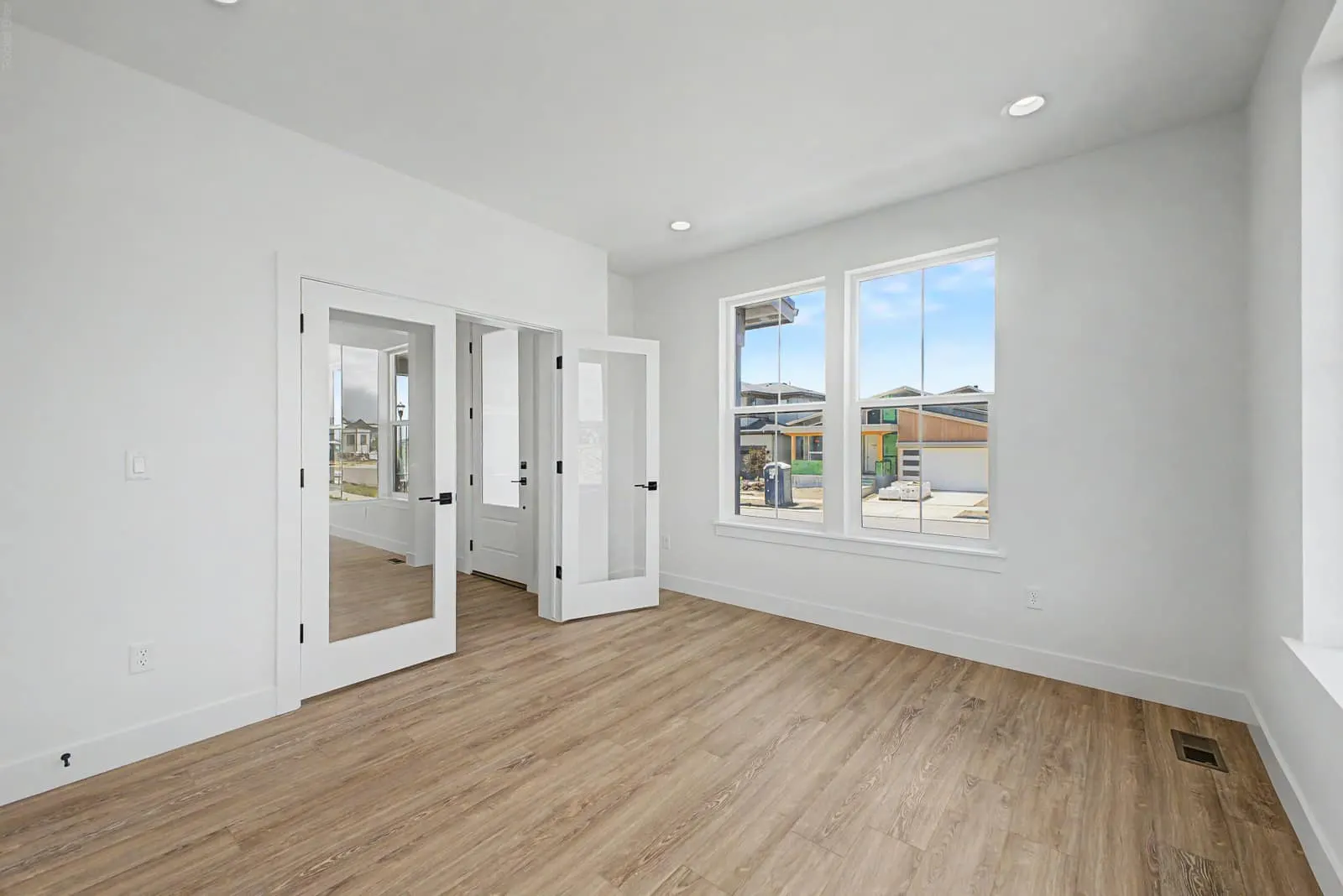 Living area with patio doors at 5588 Moosehead Circle in West Grange, Longmont, Colorado