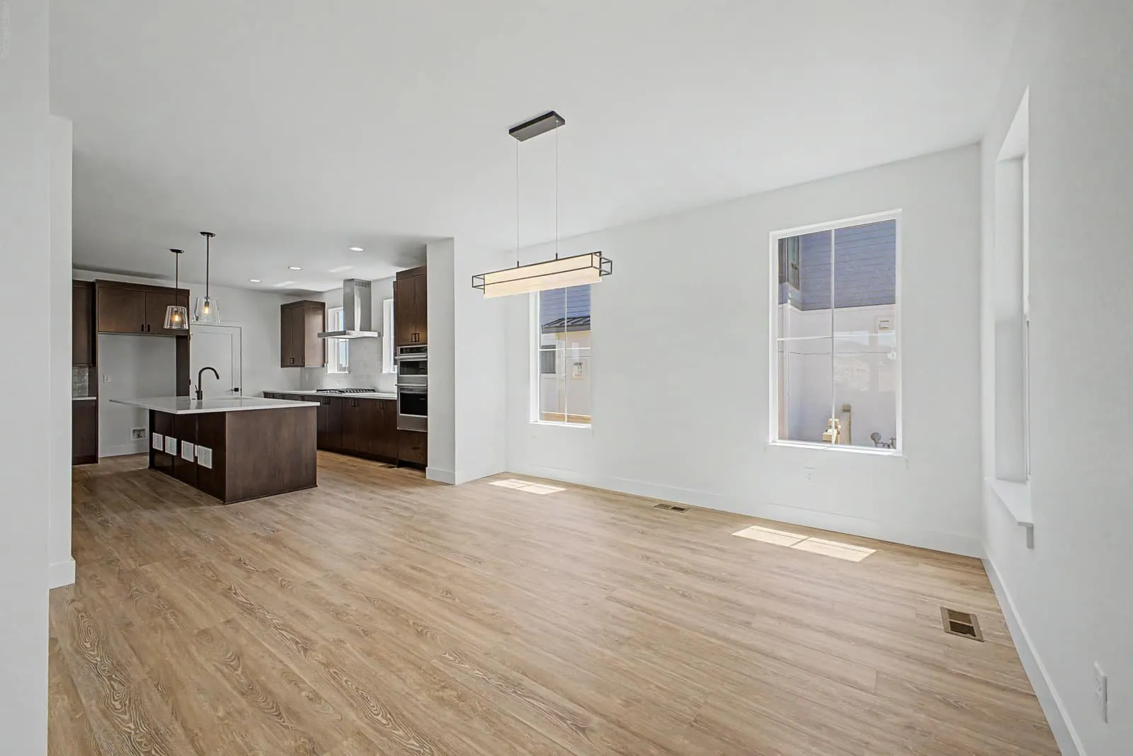 Living room opening toward the kitchen at 5588 Moosehead Circle in West Grange, Longmont, Colorado