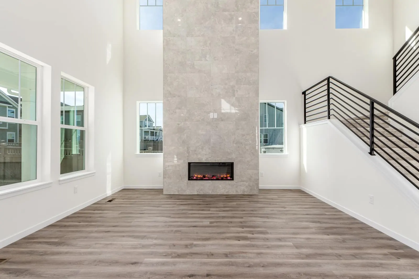 Living room with fireplace and staircase at 1590 Chestnut Avenue in Westerly, Erie, Colorado