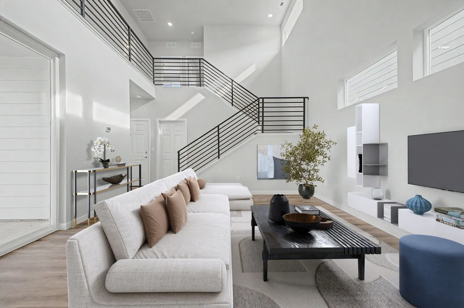 Living room with open staircase at 2773 E. 103rd Ave in Arras Park, Thornton, Colorado