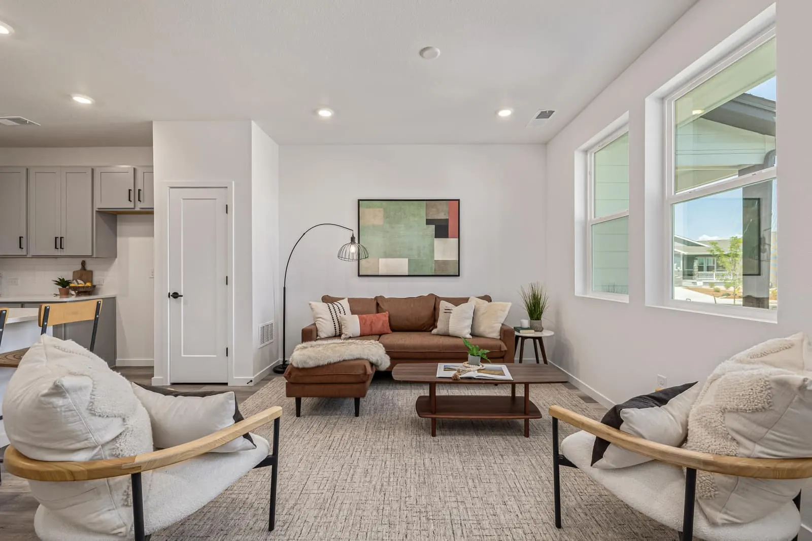 Living room with sofa and windows at 5688 N. Killarney Court in Painted Prairie, Aurora, Colorado