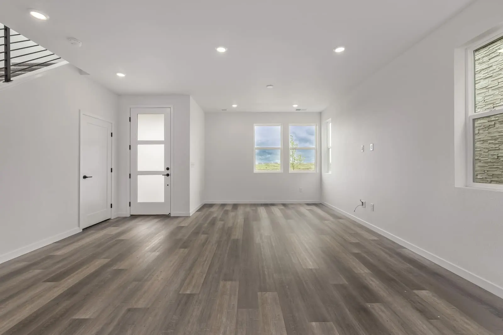 Living room with wood flooring at 20520 E. 58th Ave in Painted Prairie, Aurora, Colorado