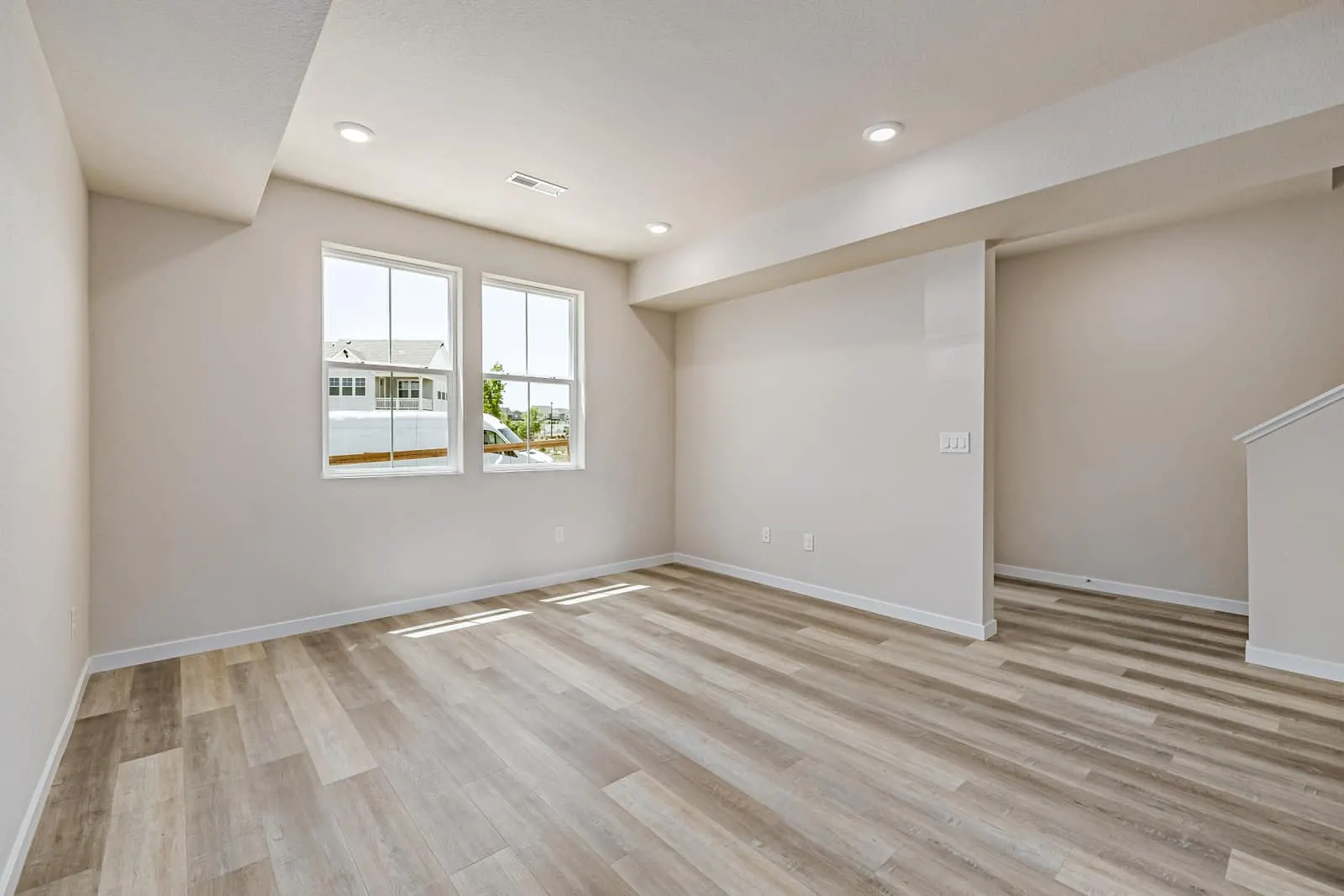 Living room with wood flooring at 2877 E. 103rd Drive in Arras Park, Thornton, Colorado