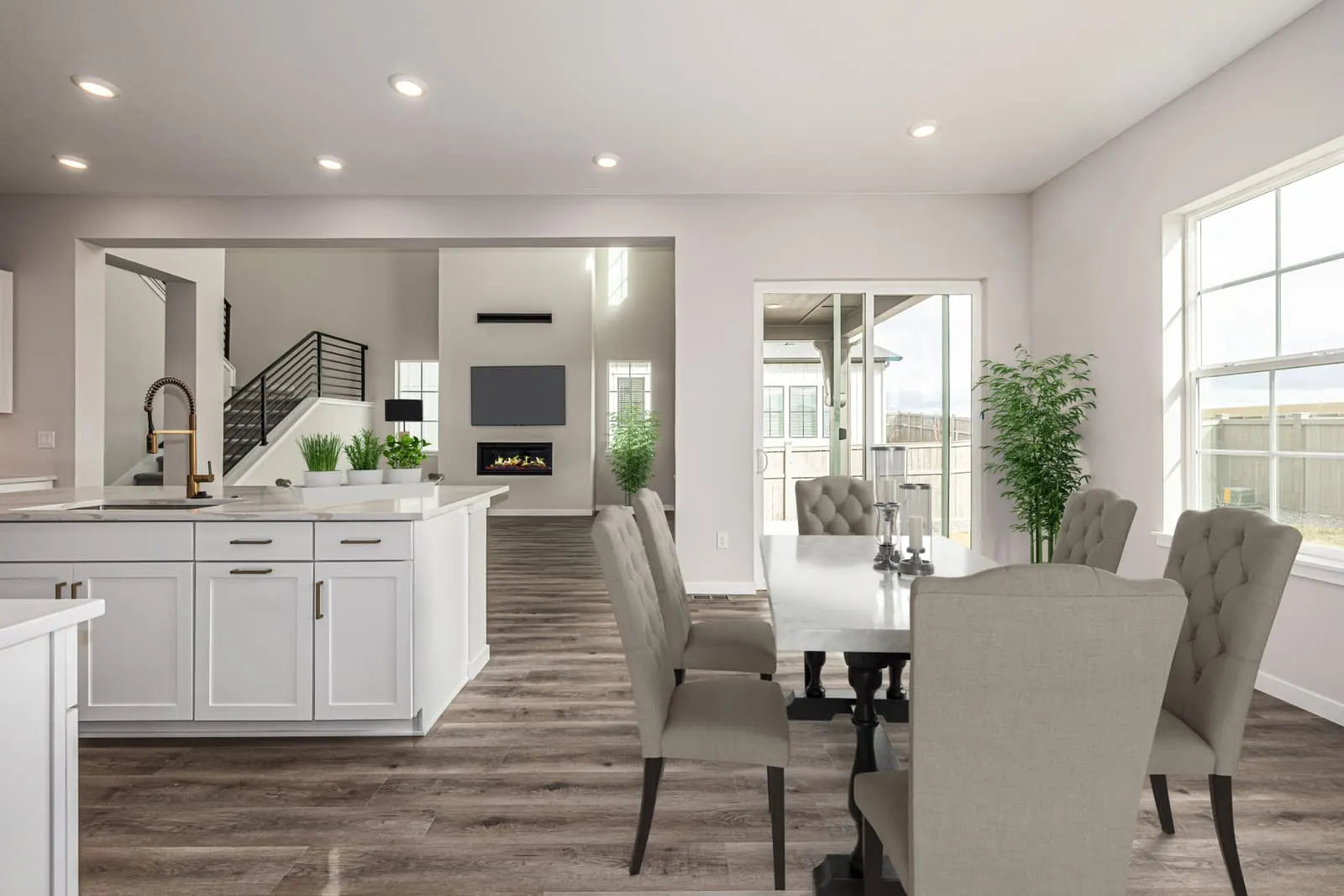 Open living room and dining area at 1898 Hickory Ave in Westerly, Erie, Colorado