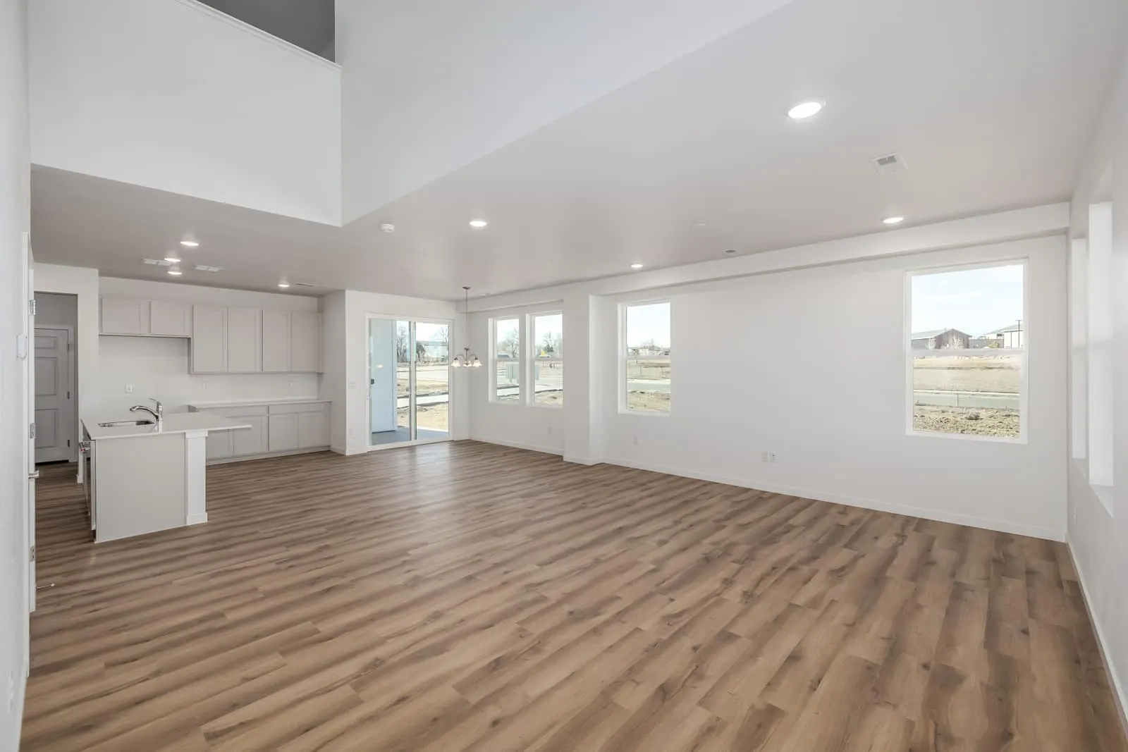 Open living room and kitchen at 2632 E 103rd Ave in Arras Park, Thornton, Colorado