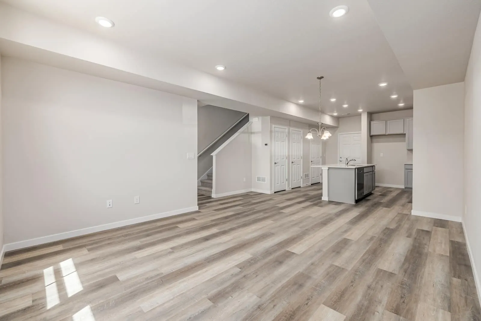 Open living room and kitchen at 2877 E. 103rd Drive in Arras Park, Thornton, Colorado