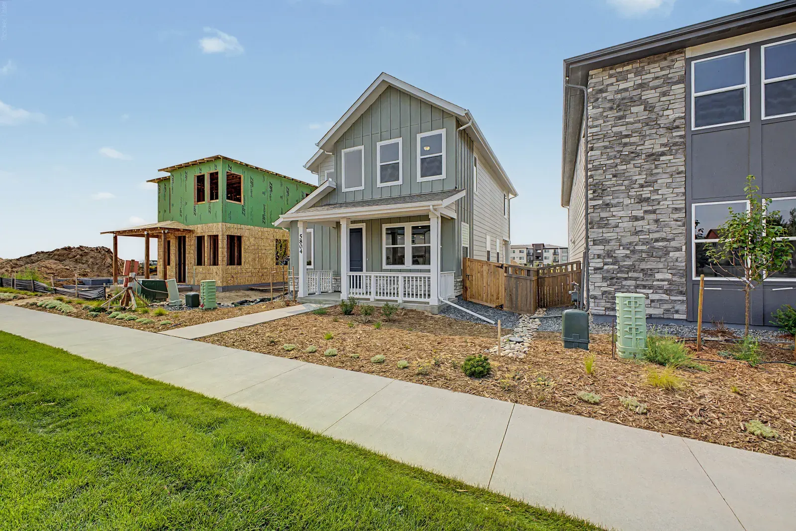 Side view of home and lawn at 5804 N Perth Street in Painted Prairie, Aurora, Colorado