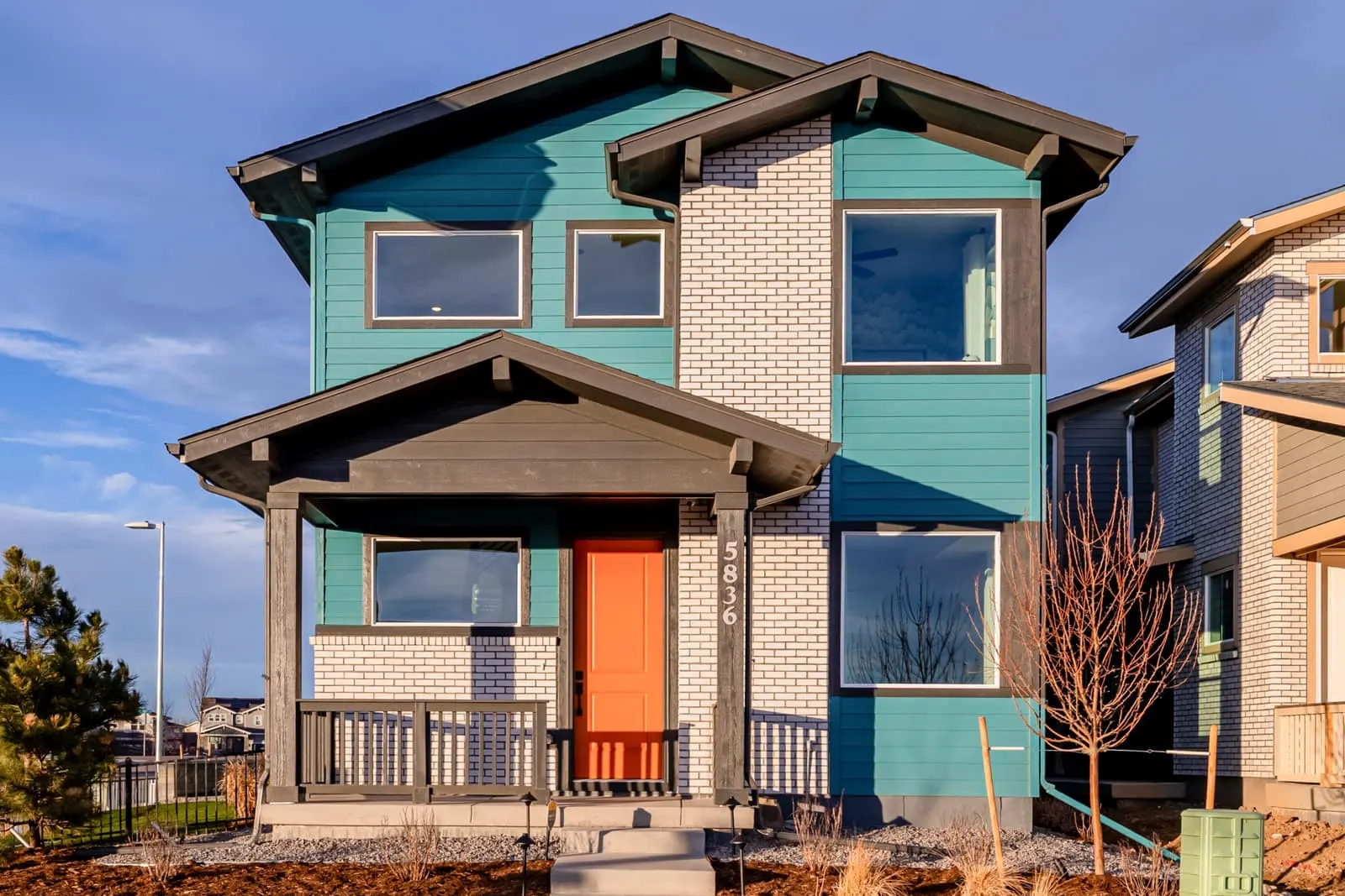 Front exterior of a two-story home at Painted Prairie in Aurora, CO 80019