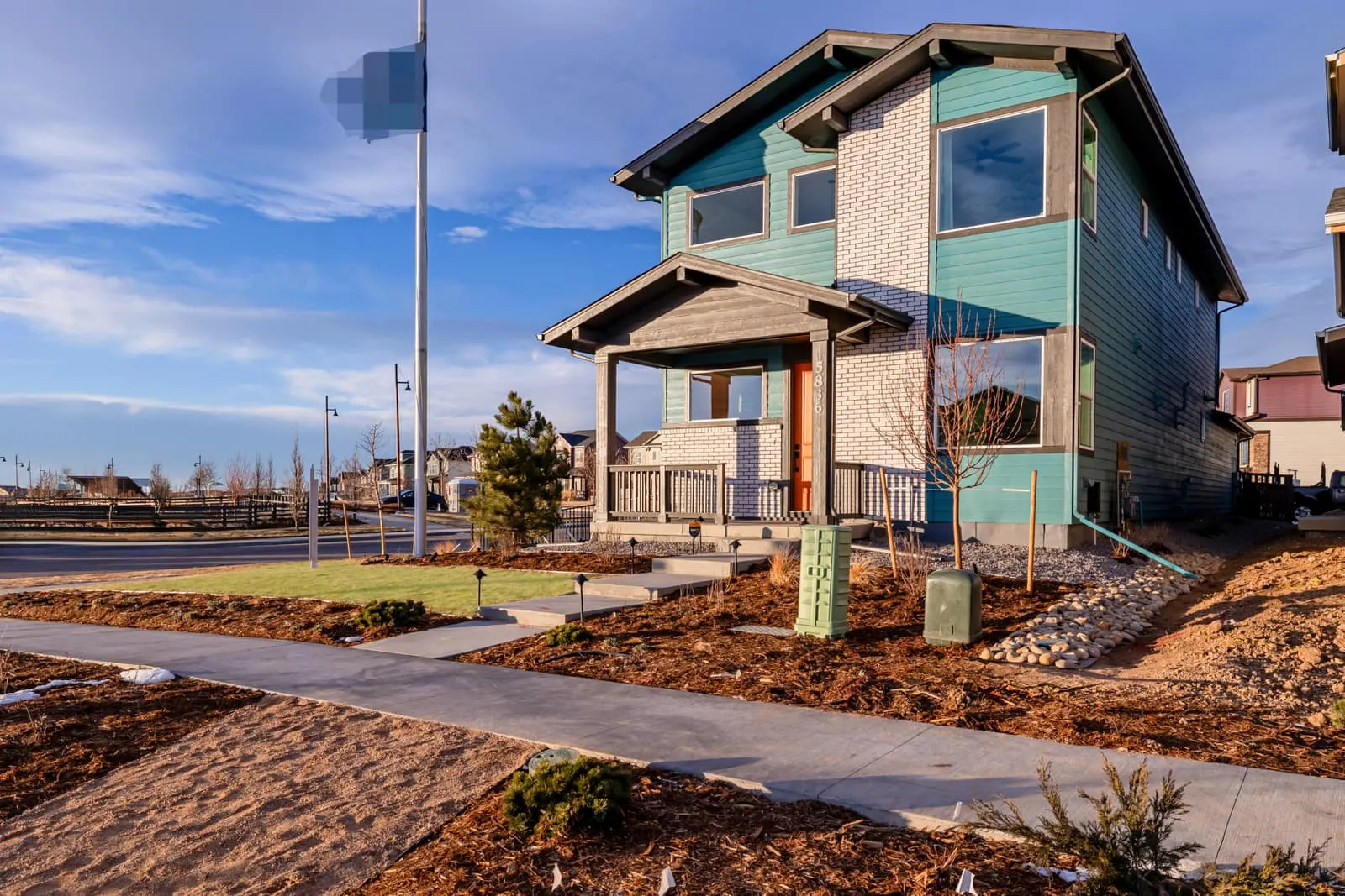 Two-story home beside a sidewalk at Painted Prairie in Aurora, CO 80019