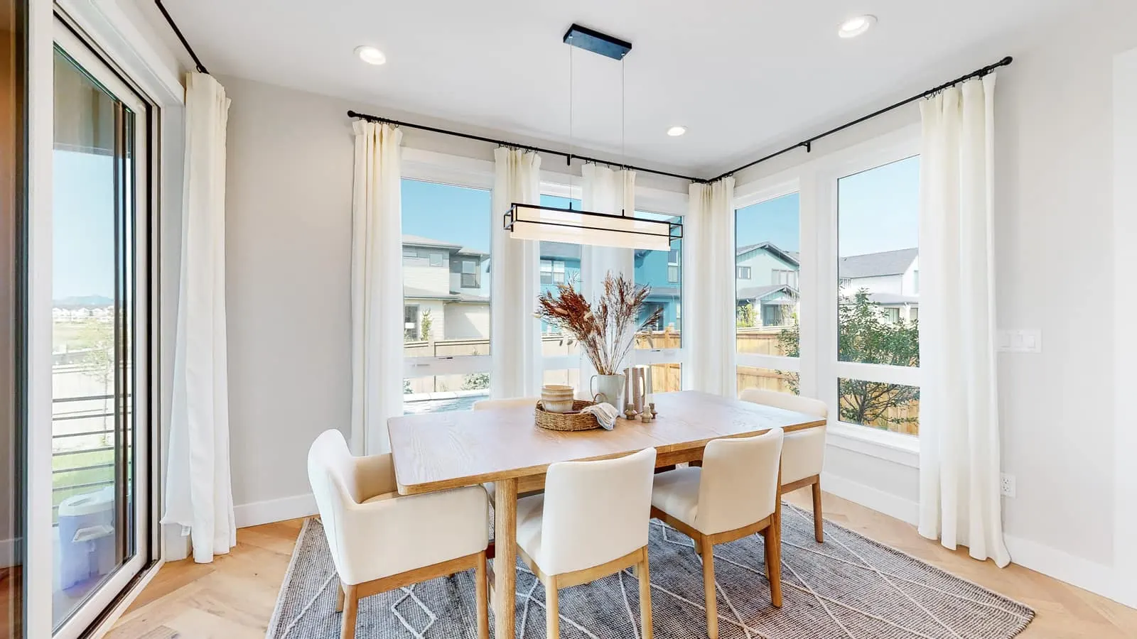 Dining area surrounded by windows at West Grange in Longmont, CO 80503