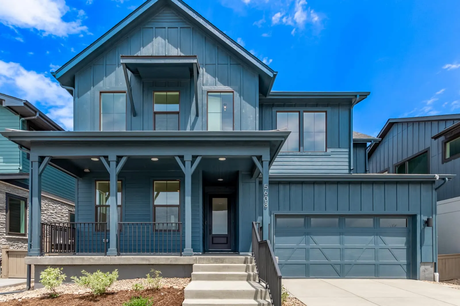 Home exterior with garage and covered entry at West Grange in Longmont, CO 80503