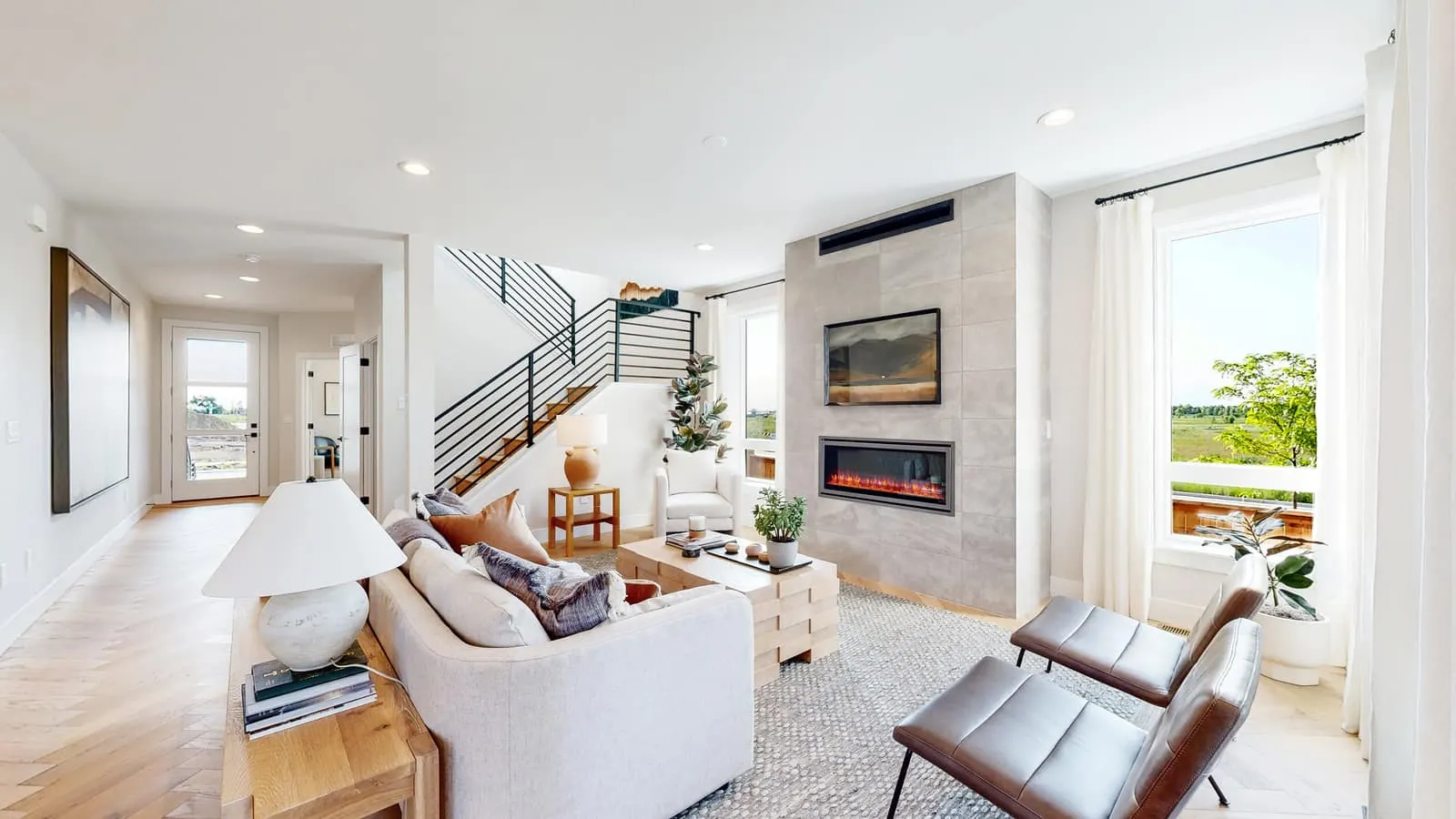 Living room beside an open staircase at West Grange in Longmont, CO 80503