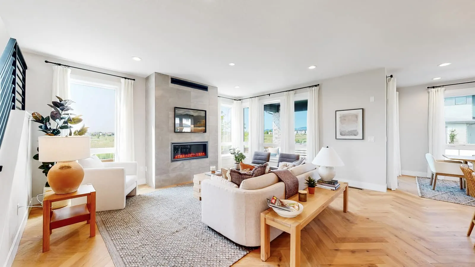 Living room with large windows at West Grange in Longmont, CO 80503